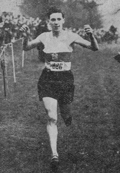 Walter Hesketh (Manchester AC) breaks the tape winning the Youth's race