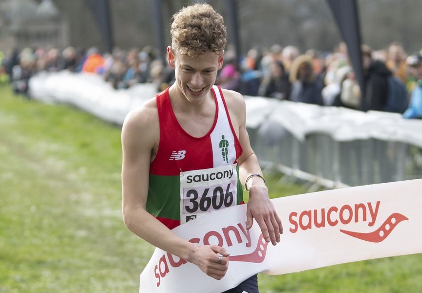 Winner Will Barnicoat (AFD) breaks the tape in the Junior Men's Race